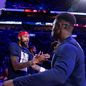 Feb 14, 2024; New Orleans, Louisiana, USA;  New Orleans Pelicans forward Brandon Ingram (14) hugs forward Zion Williamson (1) as he is announced to the fans to start the game against the Washington Wizards during the first half at Smoothie King Center. 