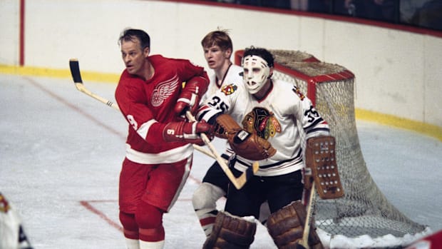 Defender Keith Magnuson (3) in action against Detroit Red Wings right wing Gordie Howe (9) a member of the 500-Goal club.