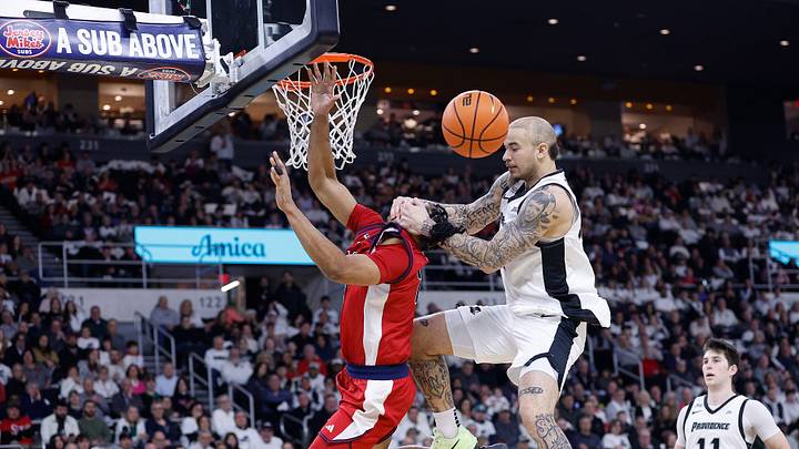 COLLEGE BASKETBALL: FEB 14 St. John's at Providence; Providence's Duncan Powell fouls St. John's basketball forward Bryce Hopkins
