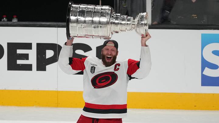 Jun 14, 2026; Las Vegas, Nevada, USA;  Carolina Hurricanes center Jordan Staal (11) raises the Stanley Cup after the win against the Vegas Golden Knights in game six of the 2026 Stanley Cup Final at T-Mobile Arena. Mandatory Credit: Lucas Peltier-Imagn Images