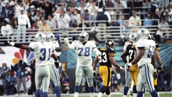 Jan 28, 1996; Tempe, AZ, USA; FILE PHOTO; Dallas Cowboys defensive end Leon Lett (78) reacts with teammates on the the field against the Pittsburgh Steelers during Super Bowl XXX at Sun Devil Stadium. Dallas defeated Pittsburgh 27-17.