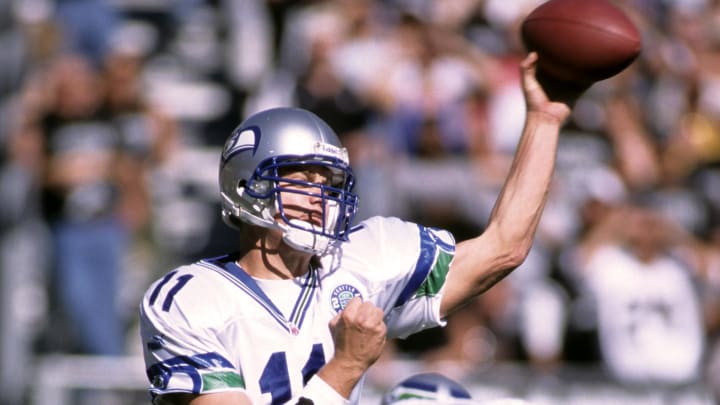 Seattle Seahawks quarterback Brock Huard (11) throws the ball against the Oakland Raiders at Oakland-Alameda County Coliseum in 2000.