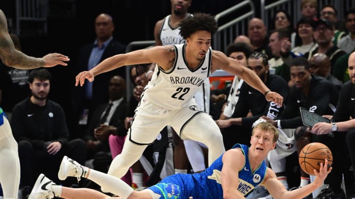 Mar 21, 2024; Milwaukee, Wisconsin, USA;  Milwaukee Bucks guard AJ Green (20) looks to pass the ball away from Brooklyn Nets forward Jalen Wilson (22) in the second quarter at Fiserv Forum. Mandatory Credit: Benny Sieu-USA TODAY Sports