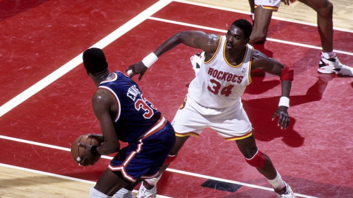Jun 1994, USA: FILE PHOTO; Houston Rockets center Hakeem Olajuwon (34) defends New York Knicks center Patrick Ewing (33) during the 1994 NBA Finals at the Summit. Mandatory Credit: MPS-USA TODAY Sports