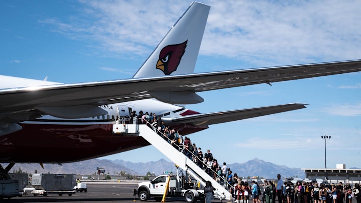 Students board the Cardinal's plane, June 22, 2022.