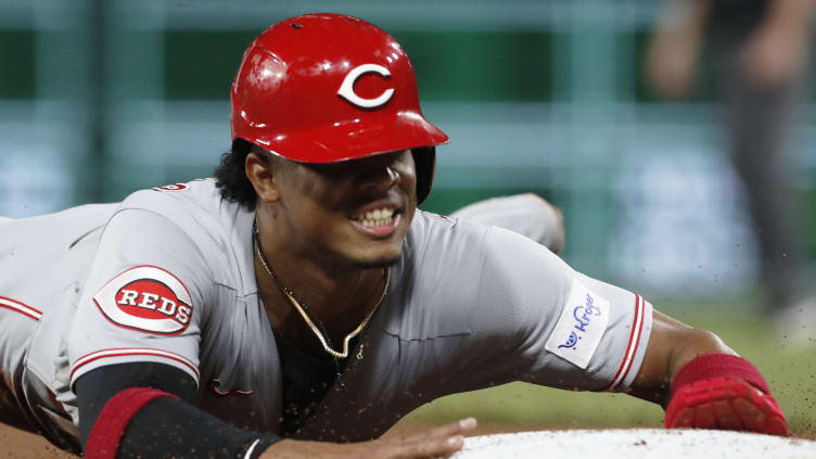 Cincinnati Reds shortstop Jose Barrero (2) advances to third base.