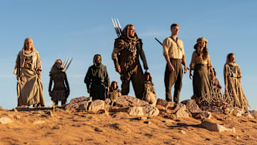 A group of Aiel with Rand (Josha Stradowski), Moiraine (Rosamund Pike) and Lan (Daniel Henney), which includes Bair (Nukâka Coster-Waldau) and Rhuarc (Björn Landberg). Image: Prime Video.