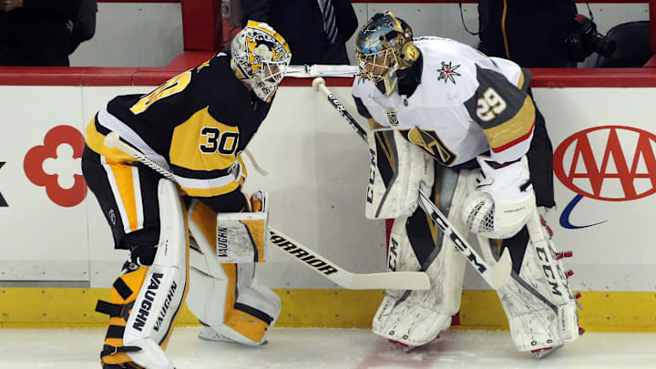 Feb 6, 2018; Pittsburgh, PA, USA;  Pittsburgh Penguins goaltender Matt Murray (30) and Vegas Golden Knights goaltender Marc-Andre Fleury (29) talk at center ice during warm-ups prior to their game at PPG PAINTS Arena. Mandatory Credit: Charles LeClaire-Imagn Images