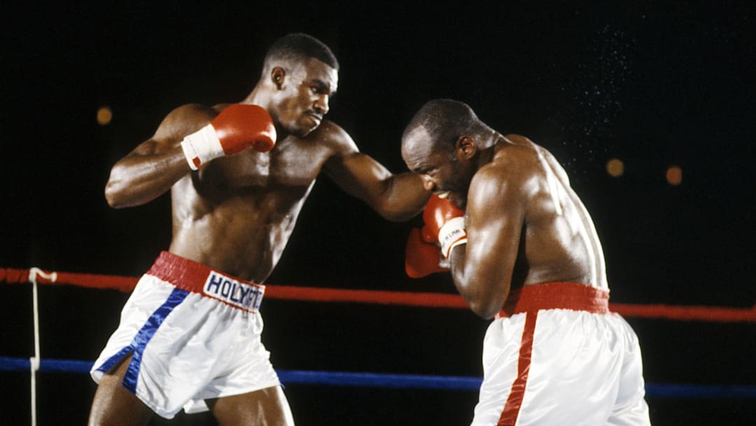Jul 12, 1986; Atlanta, GA, USA; FILE PHOTO; Evander Holyfield battles Dwight Muhammad Qawi during their 1986 cruiserweight title match at the Omni. Holyfield defeated Qawi by split decision. Mandatory Credit: Manny Rubio-Imagn Images Jul 12, 1986; Atlanta, GA, USA; FILE PHOTO; Evander Holyfield battles Dwight Muhammad Qawi during their 1986 cruiserweight title match at the Omni. Holyfield defeated Qawi by split decision. Mandatory Credit: Manny Rubio-Imagn Images