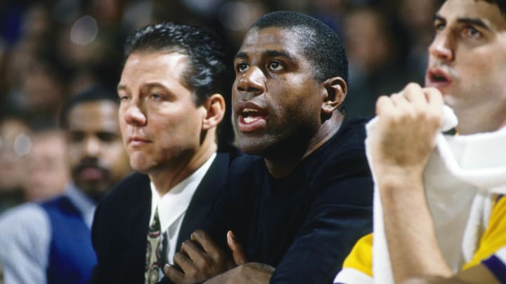 Unknown date; Los Angeles, CA, USA; FILE PHOTO; Los Angeles Lakers guard Magic Johnson on the bench next to coach Randy Pfund during the 1991-92 season at The Forum. Mandatory Credit: MPS-USA TODAY Sports