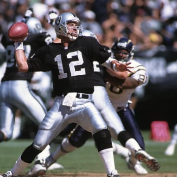 Sep 3, 2000; Oakland, CA, USA; FILE PHOTO; Oakland Raiders quarterback Rich Gannon (12) in action against the San Diego Chargers at Oakland-Alameda County Coliseum. Mandatory Credit: Peter Brouillet-USA TODAY NETWORK
