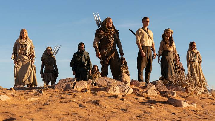 A group of Aiel with Rand (Josha Stradowski), Moiraine (Rosamund Pike) and Lan (Daniel Henney), which includes Bair (Nukâka Coster-Waldau) and Rhuarc (Björn Landberg). Image: Prime Video.