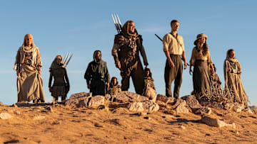 A group of Aiel with Rand (Josha Stradowski), Moiraine (Rosamund Pike) and Lan (Daniel Henney), which includes Bair (Nukâka Coster-Waldau) and Rhuarc (Björn Landberg). Image: Prime Video.