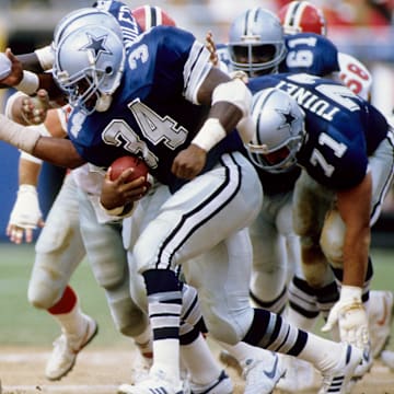 Atlanta Falcons defensive end Aundray Bruce pursues Dallas Cowboys running back Herschel Walker.