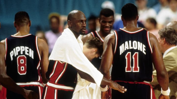 Jul 3, 1992; Portland, OR, USA: FILE PHOTO; USA dream team guard Michael Jordan reacts to teammate Karl Malone (11) against Puerto Rico during the 1992 Tournament of the Americas at Memorial Coliseum. Mandatory Credit: USA TODAY Sports