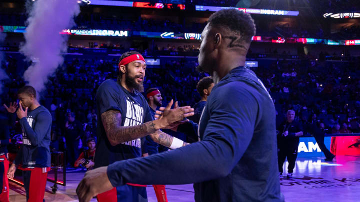 Feb 14, 2024; New Orleans, Louisiana, USA;  New Orleans Pelicans forward Brandon Ingram (14) hugs forward Zion Williamson (1) as he is announced to the fans to start the game against the Washington Wizards during the first half at Smoothie King Center