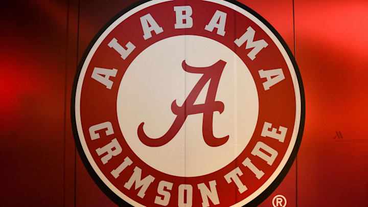 The Alabama Crimson Tide logo is seen on a wall.