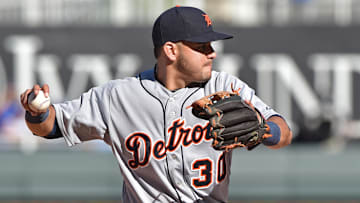 Sep 21, 2014; Kansas City, MO, USA; Detroit Tigers shortstop Eugenio Suarez (30) turns to make a throw to first against the Kansas City Royals during the eighth inning at Kauffman Stadium. Mandatory Credit: Peter G. Aiken-Imagn Images