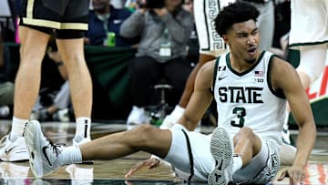 Feb 18, 2025; East Lansing, Michigan, USA;  Michigan State Spartans guard Jaden Akins (3) celebrates after a Purdue Boilermakers foul that knocked him to the floor during the second half at Jack Breslin Student Events Center. Mandatory Credit: Dale Young-Imagn Images