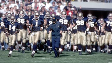 unknown date 1993; South Bend, IN, USA; FILE PHOTO; Notre Dame Irish head coach Lou Holtz leads his team onto the field during the 1993 season at Notre Dame Stadium. Mandatory Credit: Photo By Imagn Images © Copyright  Imagn Images
