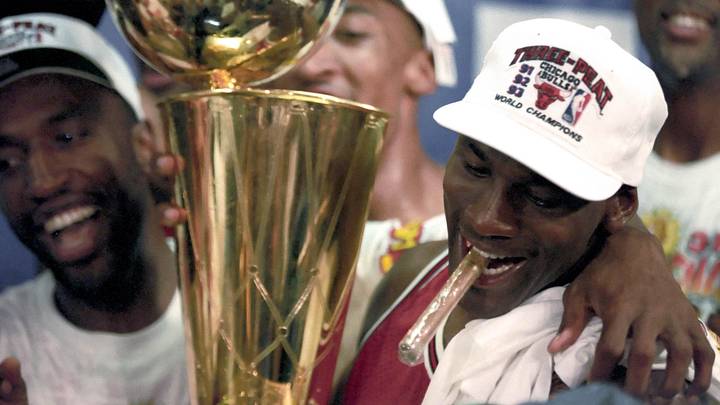 Jun 1993; Phoenix, AZ, USA; FILE PHOTO; Chicago Bulls guard Michael Jordan (right) celebrates with the championship trophy following the Bulls defeating the Phoenix Suns in the 1993 NBA Finals at America West Arena. Mandatory Credit: MPS-Imagn Images