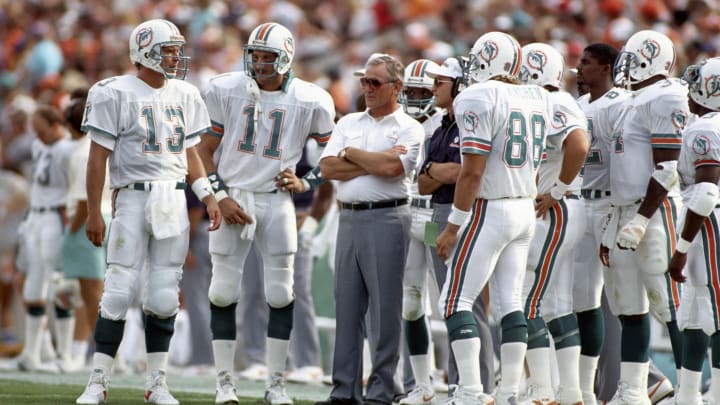 Miami Dolphins head coach Don Shula on the sidelines with quarterback (13) Dan Marino and (11) Jim Jensen against the Tampa Bay Buccaneers at Joe Robbie Stadium in 1988.