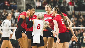 Nebraska celebrates a point against Michigan State on Friday night. The Spartans hosted an arena-record 11,578 fans at the Breslin Center. 