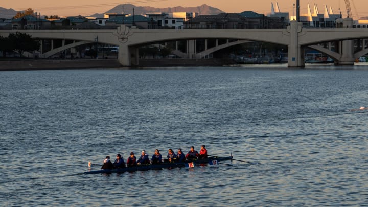 The University of Kansas Jayhawks women s rowing team trains at sunrise, Jan. 8, 2024, on Tempe Town Lake in Arizona. The temperature was 34 degrees.