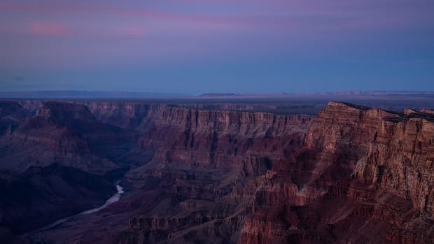 A river in the distance through the beautiful Grand Canyon.