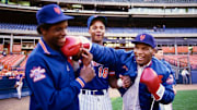 1990; Flushing, NY, USA; FILE PHOTO; New York Mets pitcher Dwight Gooden and right fielder Darryl Strawberry (18) joke around on the field with boxer Mike Tyson before a game at Shea Stadium. 