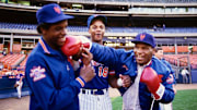 1990; Flushing, NY, USA; FILE PHOTO; New York Mets pitcher Dwight Gooden and right fielder Darryl Strawberry (18) joke around on the field with boxer Mike Tyson
