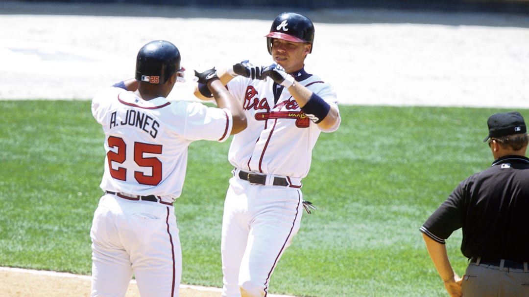 Atlanta Braves outfielder Andruw Jones celebrates with third baseman Chipper Jones Credit: RVR Photos-Imagn Images