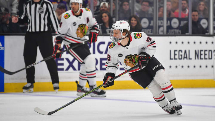 Apr 18, 2024; Los Angeles, California, USA; Chicago Blackhawks center Connor Bedard (98) controls the puck against the Los Angeles Kings during the first period at Crypto.com Arena. Mandatory Credit: Gary A. Vasquez-USA TODAY Sports