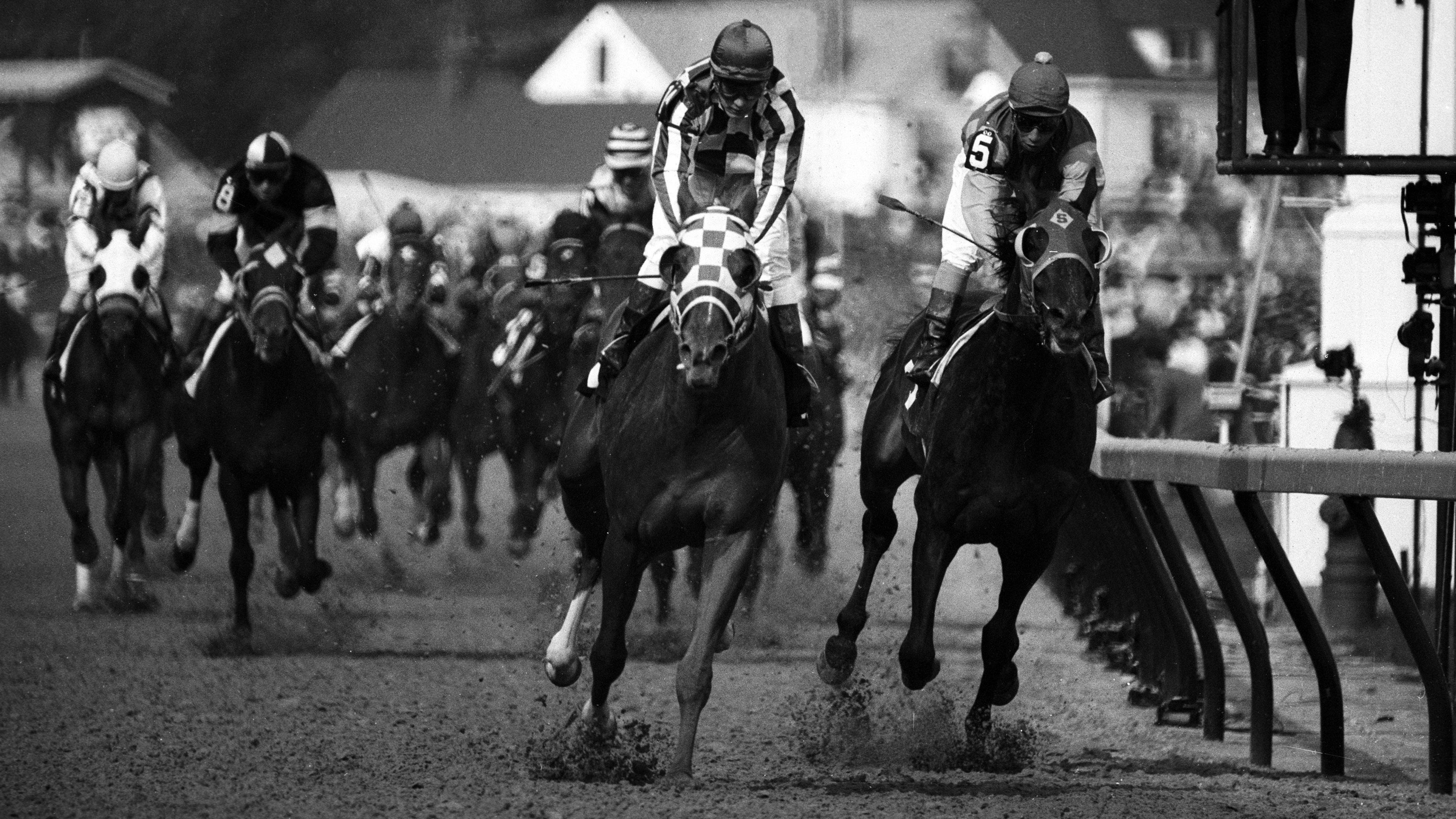Ron Turcotte aboard Secretariat (left) edges ahead of Laffit Pincay Jr. aboard Sham (right) near the finish of the 99th Kentu