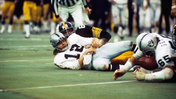 Dec 23, 1972; Pittsburgh, PA, USA; FILE PHOTO; Pittsburgh Steelers defensive end (68) LC Greenwood sacks Oakland Raiders quarterback (12) Ken Stabler causing him to fumble during the 1972 AFC Divisional Playoff game at Three Rivers Stadium. The Steelers defeated the Raiders 13-7. Mandatory Credit: Tony Tomsic-USA TODAY NETWORK