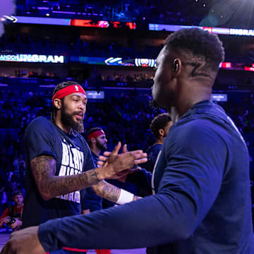 New Orleans Pelicans forward Brandon Ingram (14) hugs forward Zion Williamson (1) before game against the Washington Wizards at Smoothie King Center. 