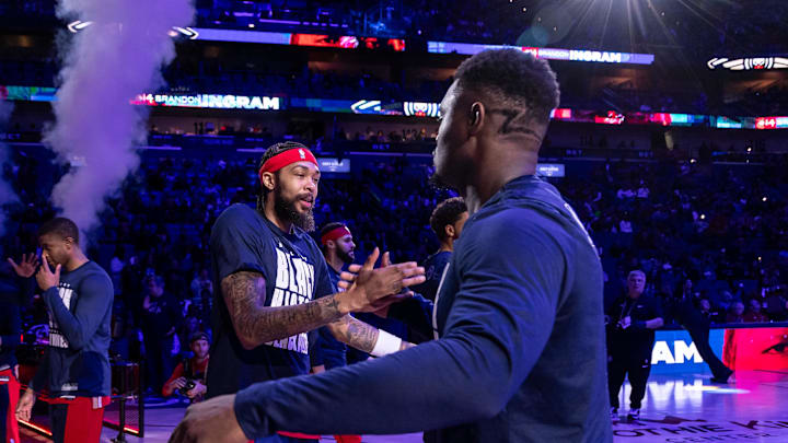 New Orleans Pelicans forward Brandon Ingram (14) hugs forward Zion Williamson (1) before game against the Washington Wizards at Smoothie King Center. 