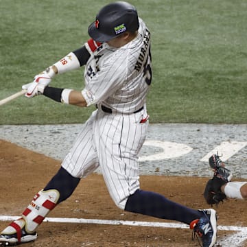 Mar 21, 2023; Miami, Florida, USA; Japan third baseman Munetaka Murakami (55) hits a home run against the USA in the second inning at LoanDepot Park. Mandatory Credit: Rhona Wise-Imagn Images