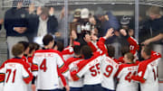 The Morgantown (W.Va.) Mohawks hockey team celebrates its first Penguins Cup championship with their fans Tuesday night at the UPMC Lemieux Complex. The Mohawks won the varsity Division 2 crown with a 5-1 win over Burrell.