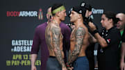 Max Holloway and Dustin Poirier during weigh ins for UFC 236 at State Farm Arena. 