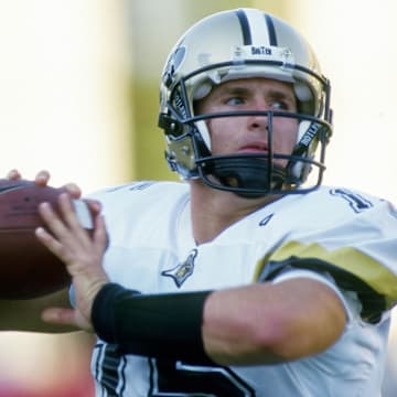 Purdue Boilermakers quarterback Drew Brees (15) warms up 