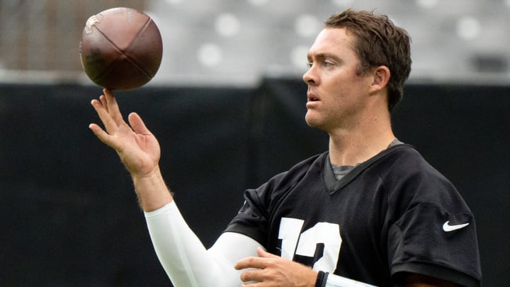 QB Colt McCoy spins a football during training camp at State Farm Stadium in Glendale on July 31, QB Colt McCoy spins a football during training camp at State Farm Stadium in Glendale on July 31,
