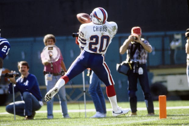 Buffalo Bills running back Joe Cribbs in action against the Baltimore Colts linebacker Barry Krauss pursues.