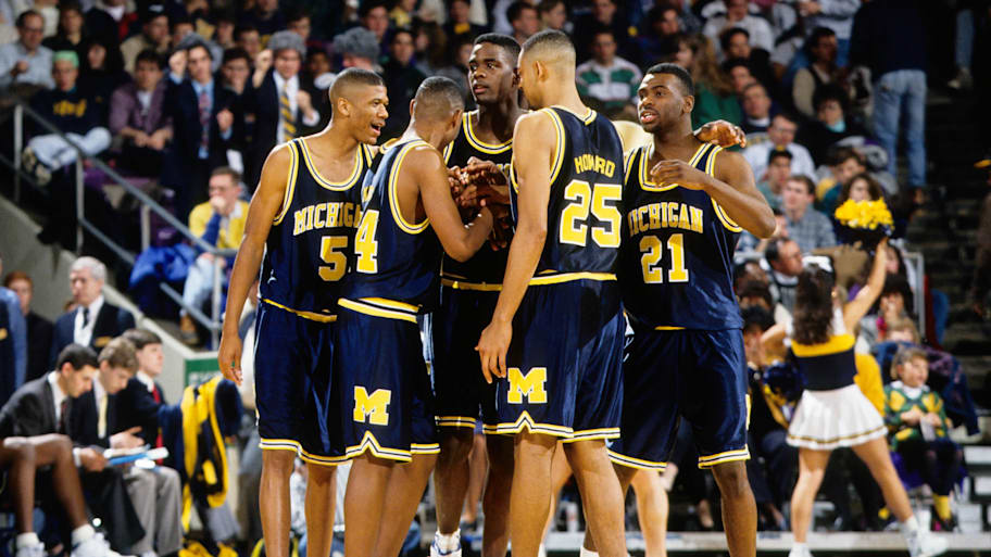 Michigan’s ‘Fab Five’ huddles together during a game against Notre Dame.