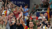 Jul 31, 2024; Paris, France; Rafael Nadal (ESP) waves to the crowd after losing to Austin Krajicek and Rajeev Ram (USA) in a men's doubles quarterfinal tennis match during the Paris 2024 Olympic Summer Games at Stade Roland Garros. Mandatory Credit: Kirby Lee-Imagn Images