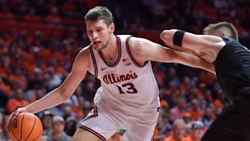 Feb 15, 2025; Champaign, Illinois, USA;  Illinois Fighting Illini center Tomislav Ivisic (13) drives around Michigan State Spartans forward Jaxon Kohler (0) during the first half at State Farm Center. Mandatory Credit: Ron Johnson-Imagn Images