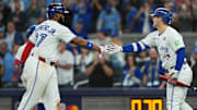 Oct 24, 2025; Toronto, Ontario, CAN; Toronto Blue Jays first baseman Vladimir Guerrero Jr. (27) celebrates with center fielder Daulton Varsho (5) after scoring in the sixth inning against the Los Angeles Dodgers during game one of the 2025 MLB World Series at Rogers Centre. 