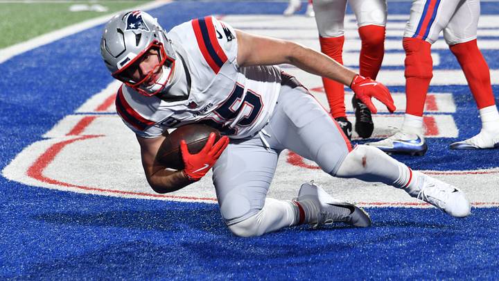 Dec 22, 2024; Orchard Park, New York, USA; New England Patriots tight end Hunter Henry (85) scores a touchdown  against the Buffalo Bills in the fourth quarter at Highmark Stadium. Mandatory Credit: Mark Konezny-Imagn Images