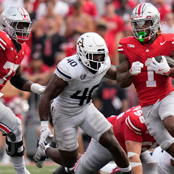 Aug 31, 2024; Columbus, OH, USA; Ohio State Buckeyes running back Quinshon Judkins (1) runs past Akron Zips linebacker Bryan McCoy (40) during the first half of the NCAA football game at Ohio Stadium.