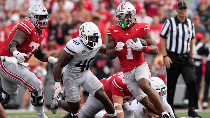 Aug 31, 2024; Columbus, OH, USA; Ohio State Buckeyes running back Quinshon Judkins (1) runs past Akron Zips linebacker Bryan McCoy (40) during the first half of the NCAA football game at Ohio Stadium.